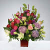 Big arrangement with mixed colors and one face.