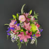 A delightful basket filled with fragrant flowers including Rose Lilies, Alstroemeria, Gerbera