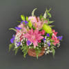 A delightful basket filled with fragrant flowers including Rose Lilies, Alstroemeria, Gerbera