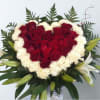 This favorite is a heart shaped filled with reds and some whites