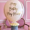 This sophisticated birthday gift combines a large champagne-colored balloon with custom lettering