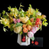 Hand tied bouquet with seasonal bright toned floral varieties, it is delivered