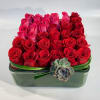 An opulent pave&#039; of roses designed with lush roses finished with sculpted