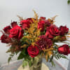 This vase of brilliant red roses is an elegant and natural way