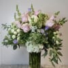 A seasonal mix arrangement with Roses, Hydrangeas, Spray Roses and Designers choice