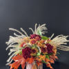 An arrangement that feels like a cozy fall day with fall leaves