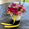 a mix of beautiful flowers in a glass vase. 