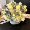 Roses, Blue Thistle, Eucalyptus, Tulips and Hydrangeas. Flowers and color can change