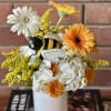 This cheerful arrangement captures the essence of a thriving garden with its