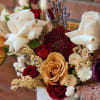 Burgundy reds beige and browns fresh cut roses, spray roses ranunculus mum