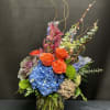 A vibrant, whimsical dance of color and texture. Featuring lush blue hydrangeas