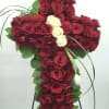 This cross-shaped arrangement offers a graceful symbol of faith and remembrance. Designed