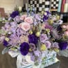 Fresh array of lavender and light pink flowers nestled in a large