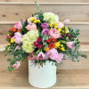 A mix of premium roses, tulips and other flowers in a box.