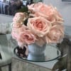 Stunning pink roses in a cupcake style vase. Sweet for your sweet!