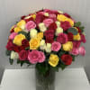 A beautiful flower arrangement in cylinder with 100 mix colors roses