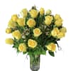 A beautiful flower arrangement with 2 dozen yellow roses with white wax