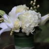 Soothing creamy and white blooms arranged in a compact fashion in a