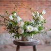 A beautiful sentiment of white or pastel toned floral varieties are designed