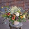 A perfect medley of fresh and dried floral materials artfully arranged in