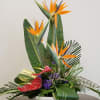 Pull them into paradise with a flower bouquet of tropical blooms that