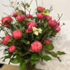 Medium high floral arrangement compose of an assortment of Coral charm peonies