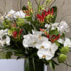 CYLINDRICAL VASE WITH JAPANESE GLORIOSA, WHITE PHALAENOPSIS ORCHIDS, VIBURNUM, THAI LEAF, AND