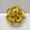 A beautiful arrangement with sunflowers in square vase