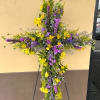 A vibrant celebration of life, this cross is filled with yellow alstroemeria