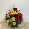 This cheerful and vibrant bouquet features a stunning mix of brightly colored
