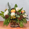 A wintertime botanical assortment of roses, hypericum berries, lotus pod, eucalyptus and