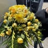 Yellow roses, yellow yolk roses, yellow mums in this beautifully made casket
