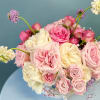 Celebrate the vibrant season with our Summer Bloom Floral Arrangement, showcasing a