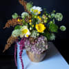 The Golden Meadow Arrangement brings together a harmonious blend of textures and