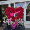 For any occasion a beautiful open heart designed with lush roses in