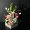 A vertical design with seasonal spring flowers in pastel mix Flowers may