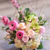 A vertical design with seasonal spring flowers in pastel mix Flowers may