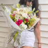 Fresh hand-tied Bouquet.features beautiful flowers that are each hanpickd with the client