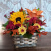 Sending this delightful basket of fresh fall flowers to someone who&#039;s on