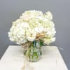 Let simplicity speak volumes with our Whispers of Grace arrangement&mdash;a lush medley