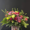 A soft pink and lavender palette in a hummingbird keepsake vase.