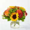 A vibrant collection of autumnal flowers makes this an excellent touch of