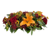 A fall oval designed centerpiece with two candle votives. Flowers consisting of