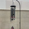 A cardinal chime with flower and greenery details.

Text Reads: &quot;When you see