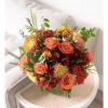 Warm Fall colored flowers in a glass cylinder or cube
roses , alstromeria