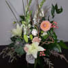  Spilling out and over with grace, these playful dahlias and snapdragons