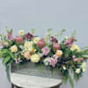 Pretty pinks and whites of protea, dahlia, cymbidium orchid, roses, stock, snapdragon