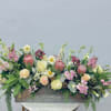 Pretty pinks and whites of protea, dahlia, cymbidium orchid, roses, stock, snapdragon
