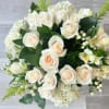 12 white roses, 4 white hydrangeas and other white flowers in a