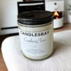 A handcrafted scented soy blend candle at our store. The candle is